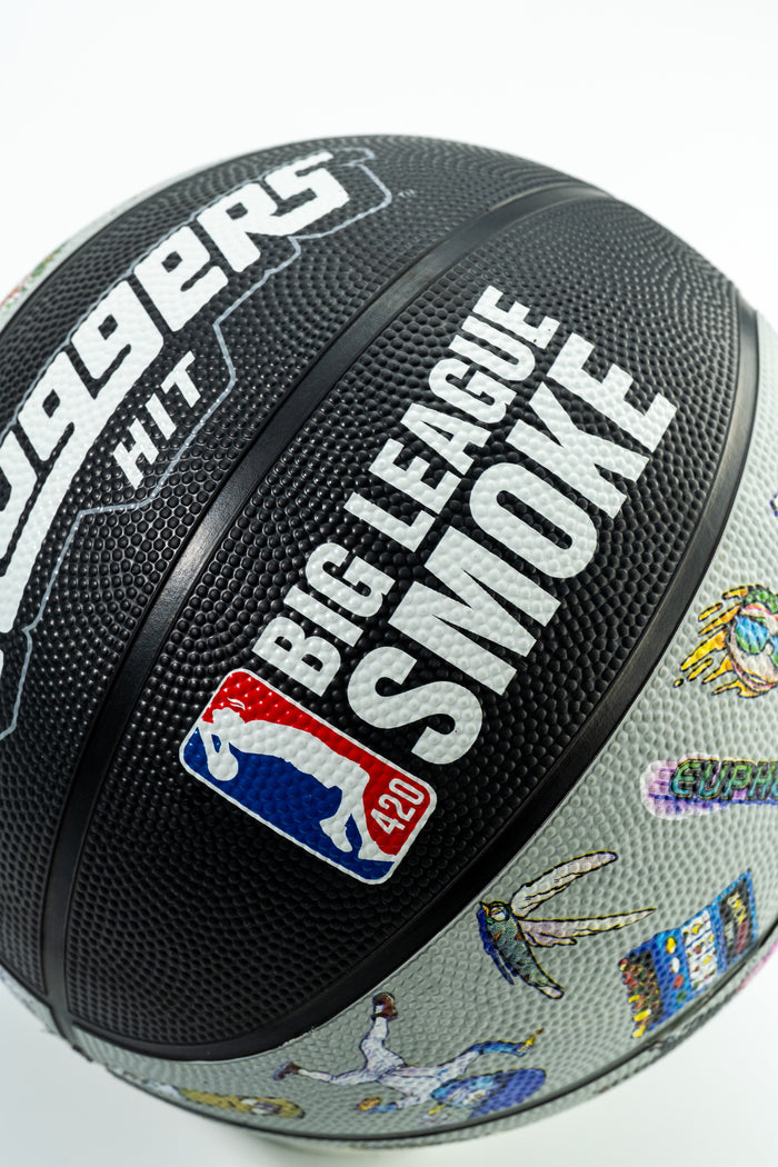 Decorative basketball with Sluggers cannabis brand graphics and multiple colorful patches