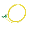 Yellow fiber optic cable with green connectors on a white background
